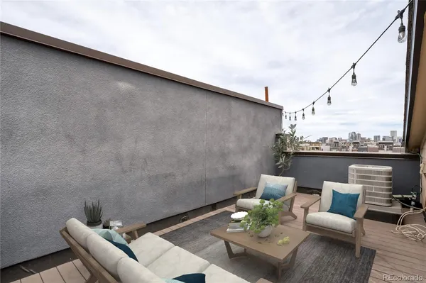 an outdoor living room with furniture