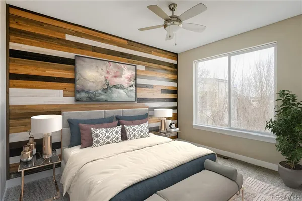 a bedroom with a large bed and a window