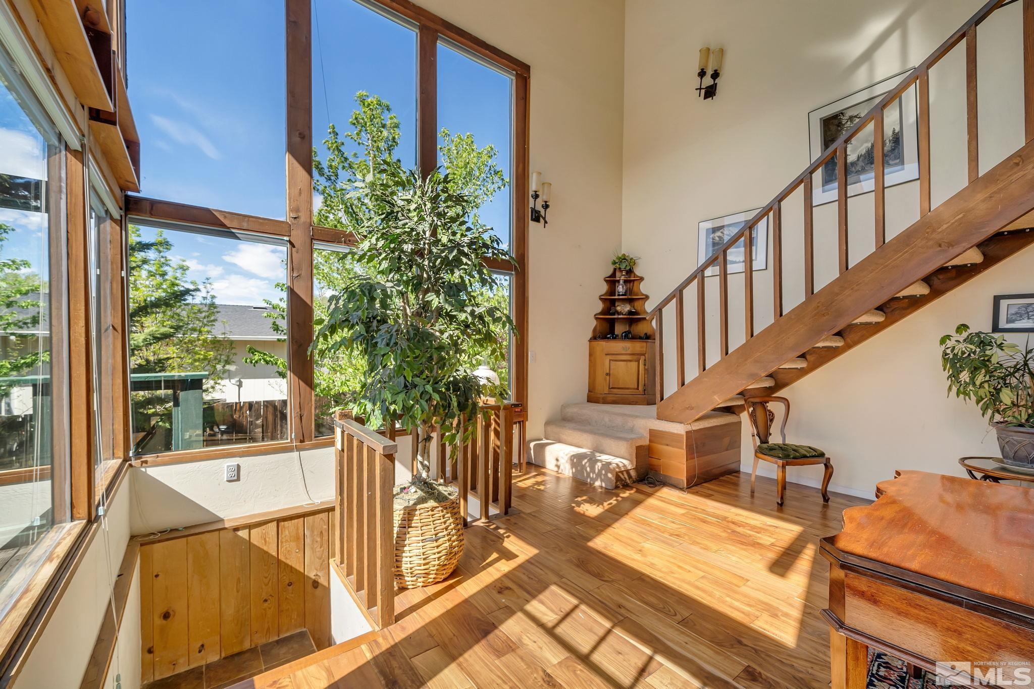 14615 Virginia Foothills Drive Reno, NV 89521 - Photo 11 of 27 a view of an living room with balcony and furniture