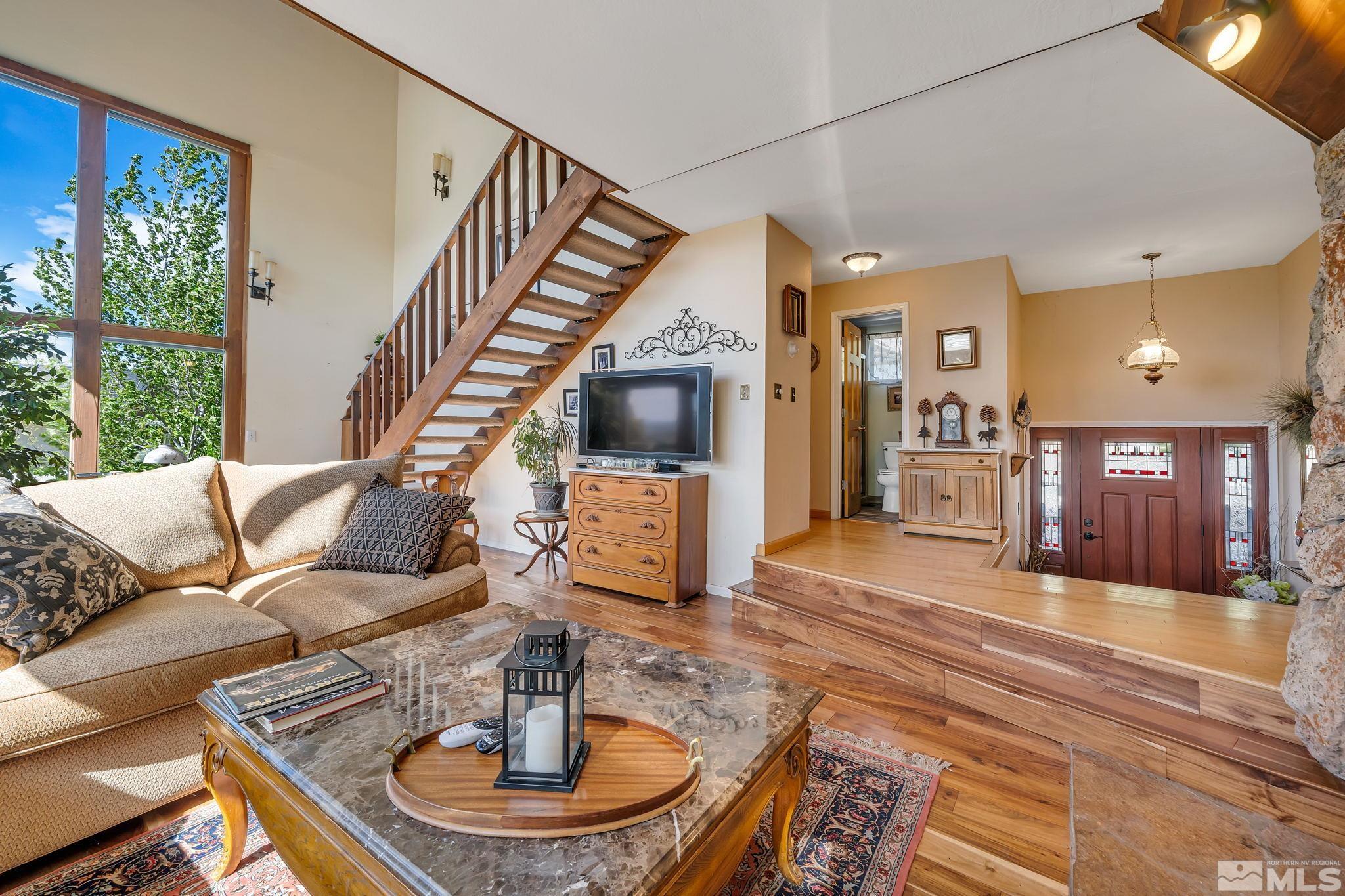 14615 Virginia Foothills Drive Reno, NV 89521 - Photo 14 of 27 a living room with furniture and a fireplace