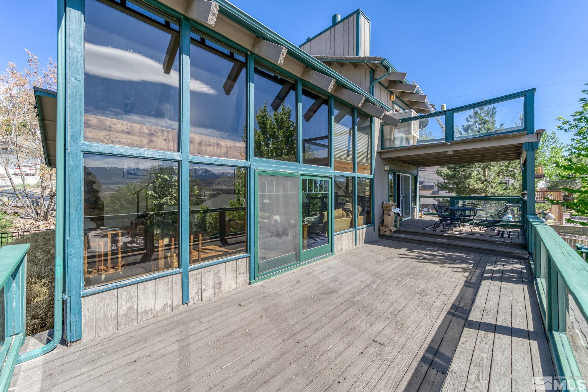 14615 Virginia Foothills Drive Reno, NV 89521 - Photo 23 of 27 a view of a house with porch and wooden floor