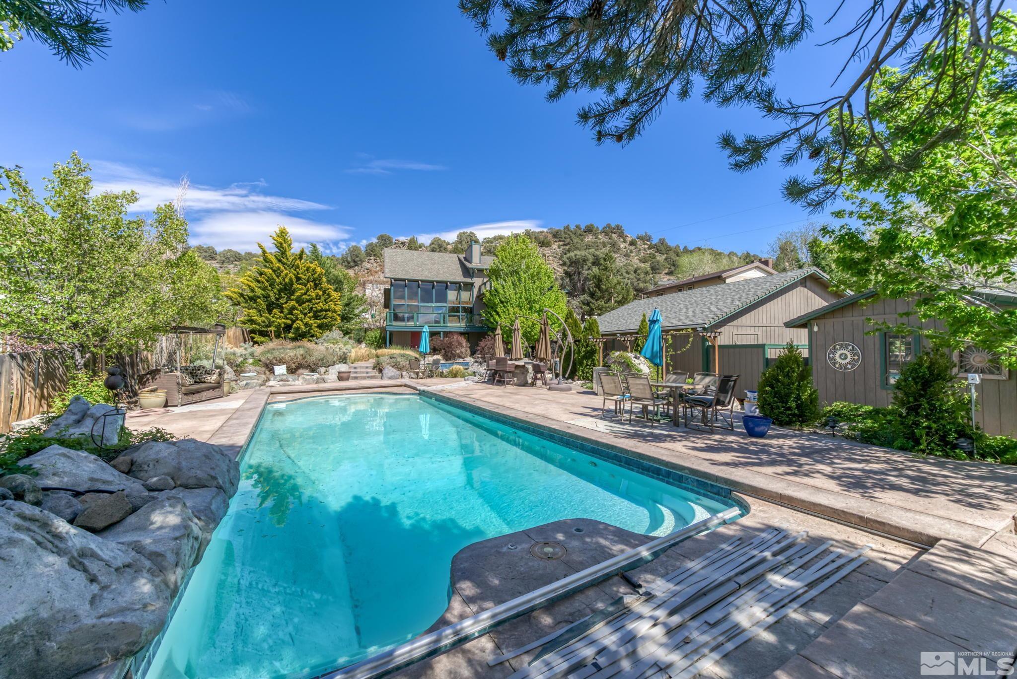 14615 Virginia Foothills Drive Reno, NV 89521 - Photo 26 of 27 a view of a swimming pool with a patio