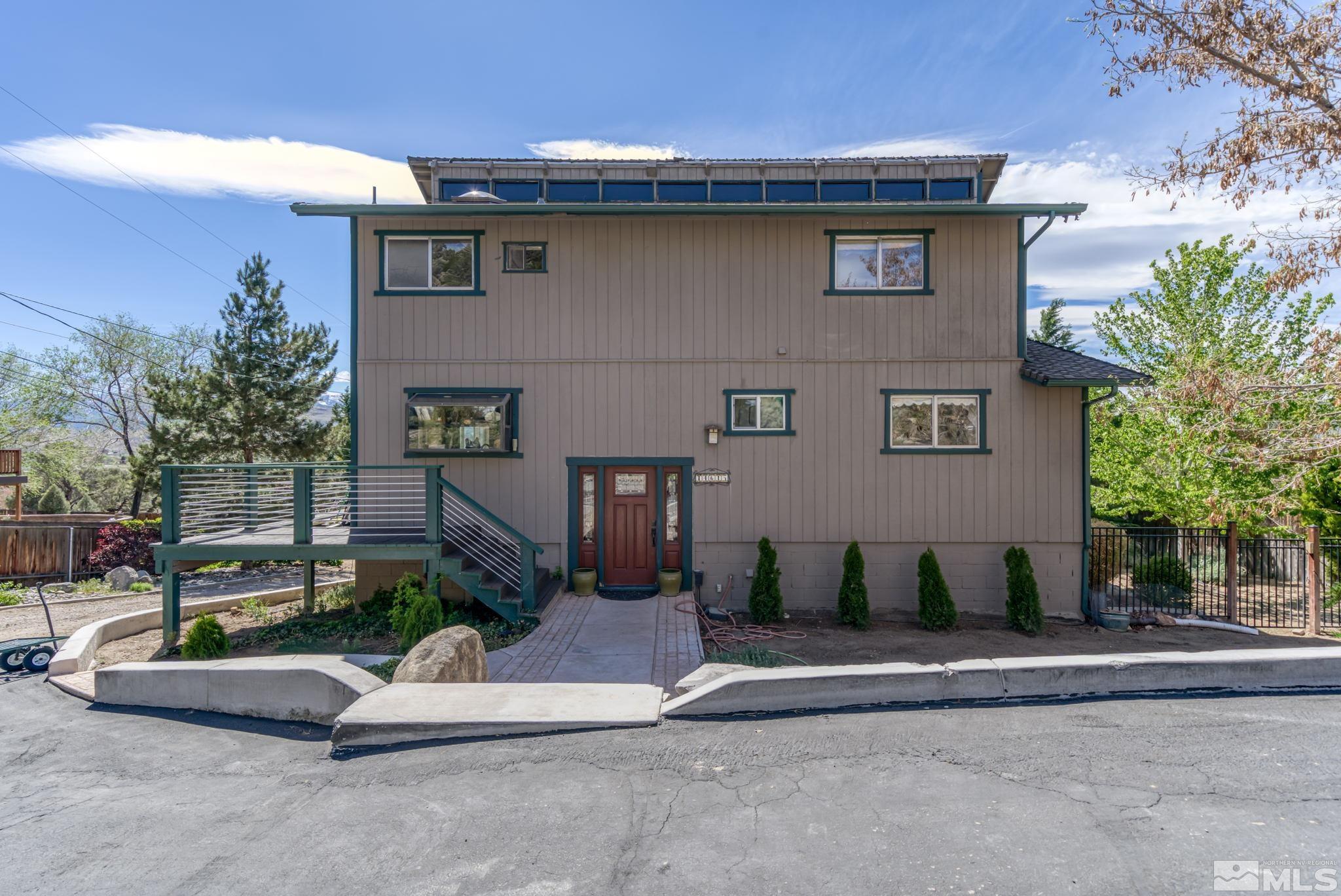 14615 Virginia Foothills Drive Reno, NV 89521 - Photo 4 of 27 a view of a house with a yard and plants