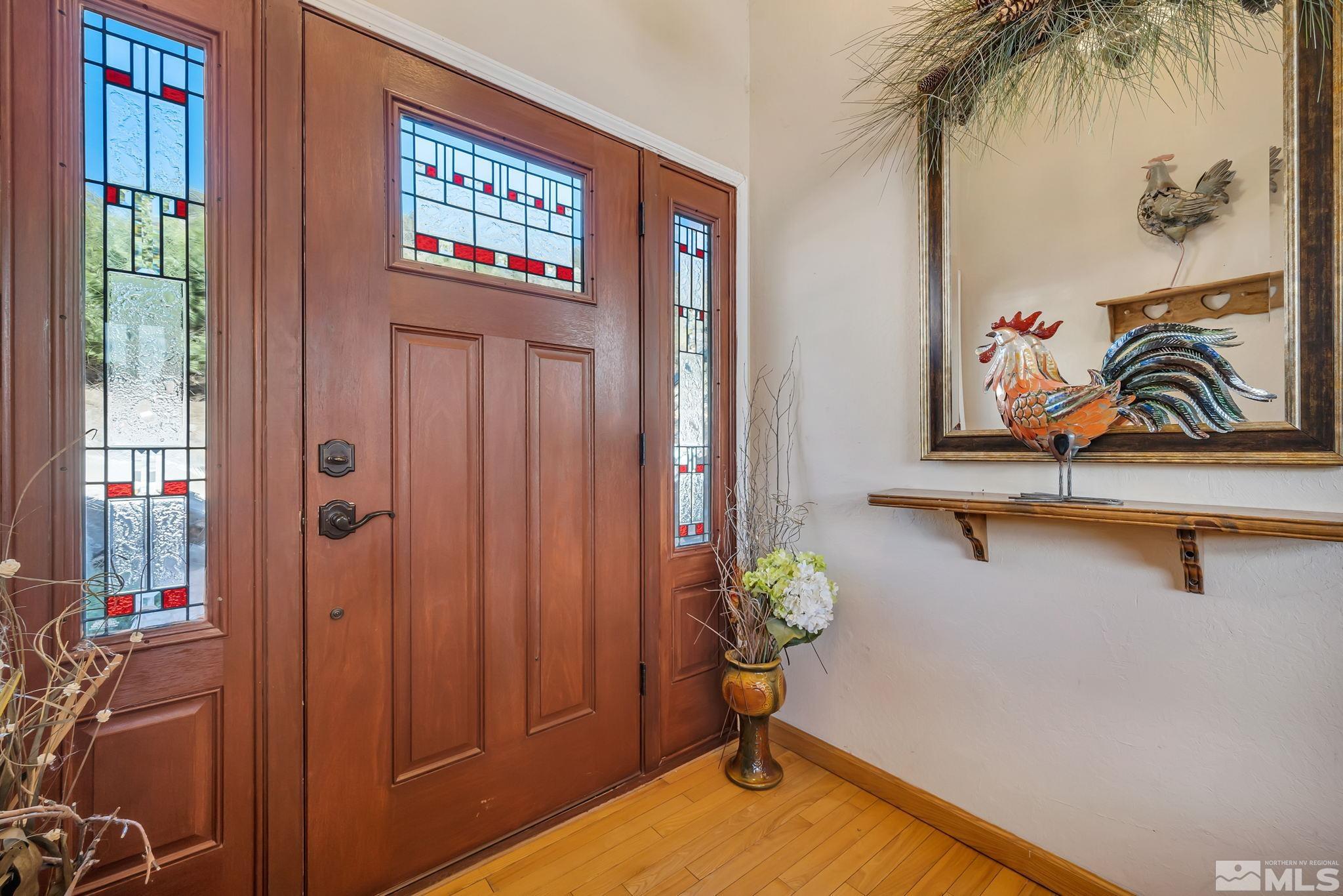 14615 Virginia Foothills Drive Reno, NV 89521 - Photo 6 of 27 a view of a hallway with paintings on the wall