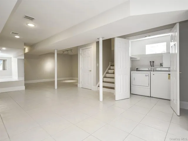 a view of a kitchen with a sink and a window