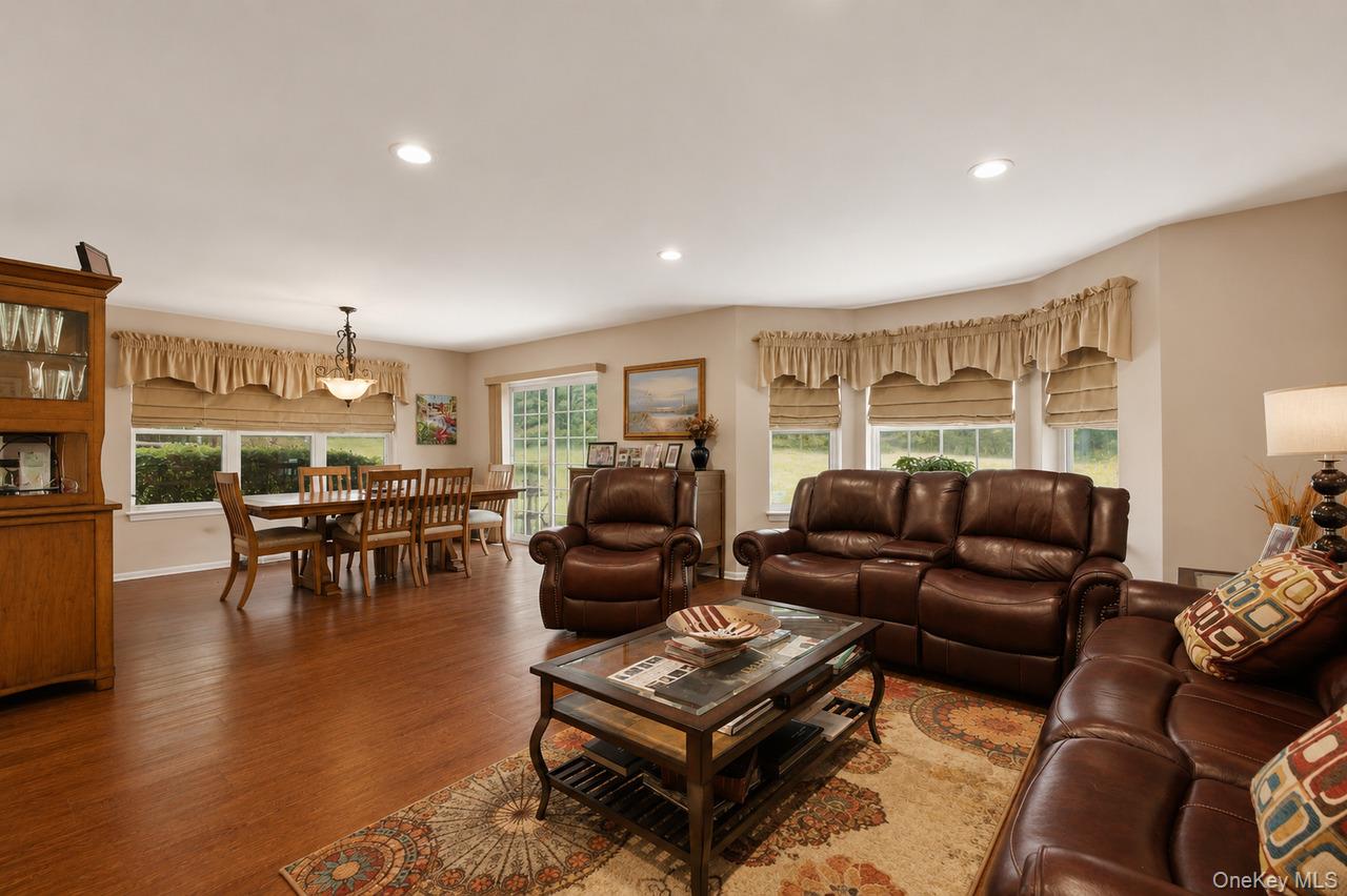 64 Roma Orchard Road Peekskill, NY 10566 - Photo 12 of 40 Expansive room with wood-finish flooring, recessed lighting, and neutral wall tones