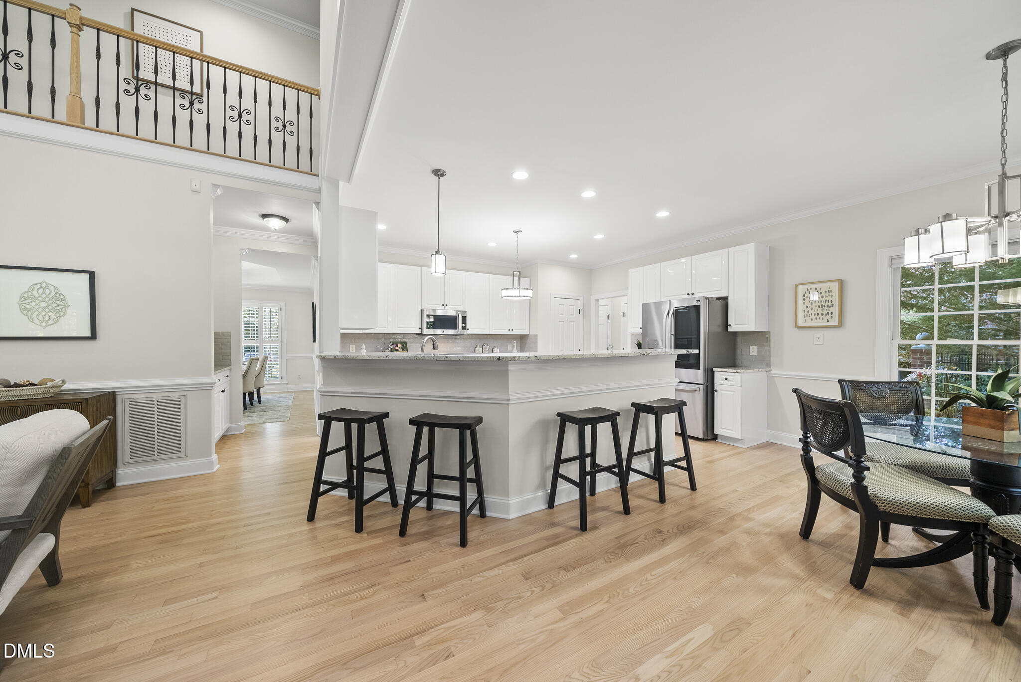 305 Ridge Creek Drive Morrisville, NC 27560 - Photo 15 of 43 a dining room with furniture and wooden floor