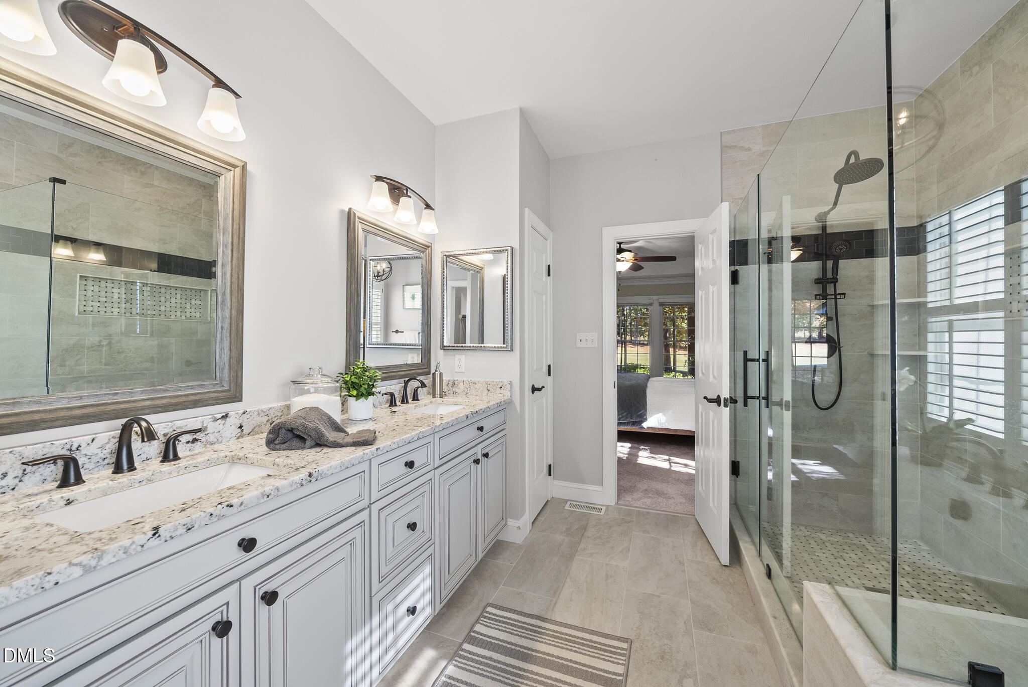 305 Ridge Creek Drive Morrisville, NC 27560 - Photo 18 of 43 a spacious bathroom with a granite countertop sink mirror and shower