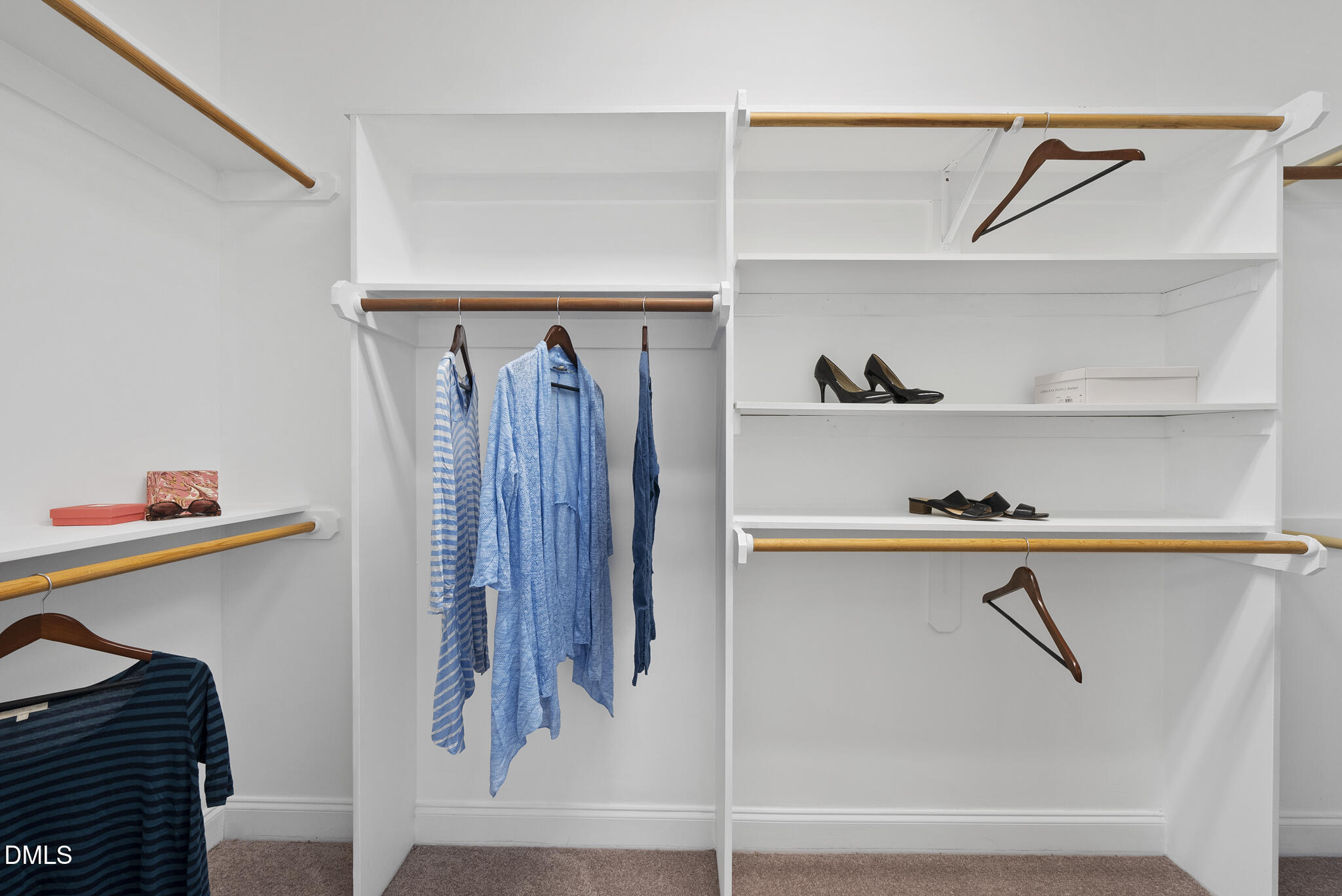 305 Ridge Creek Drive Morrisville, NC 27560 - Photo 20 of 43 a view of walk in closet with clothes and shoes