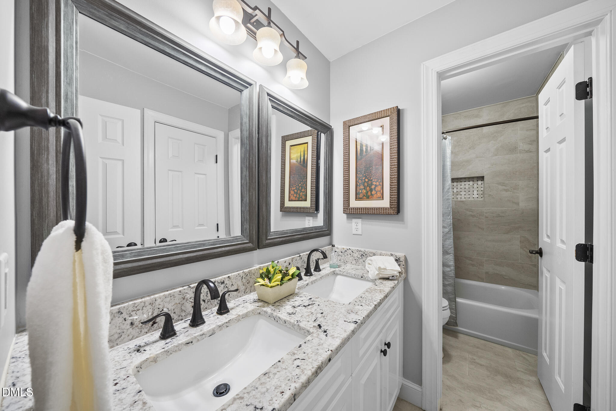 305 Ridge Creek Drive Morrisville, NC 27560 - Photo 26 of 43 a bathroom with a granite countertop double vanity sink and a bathtub
