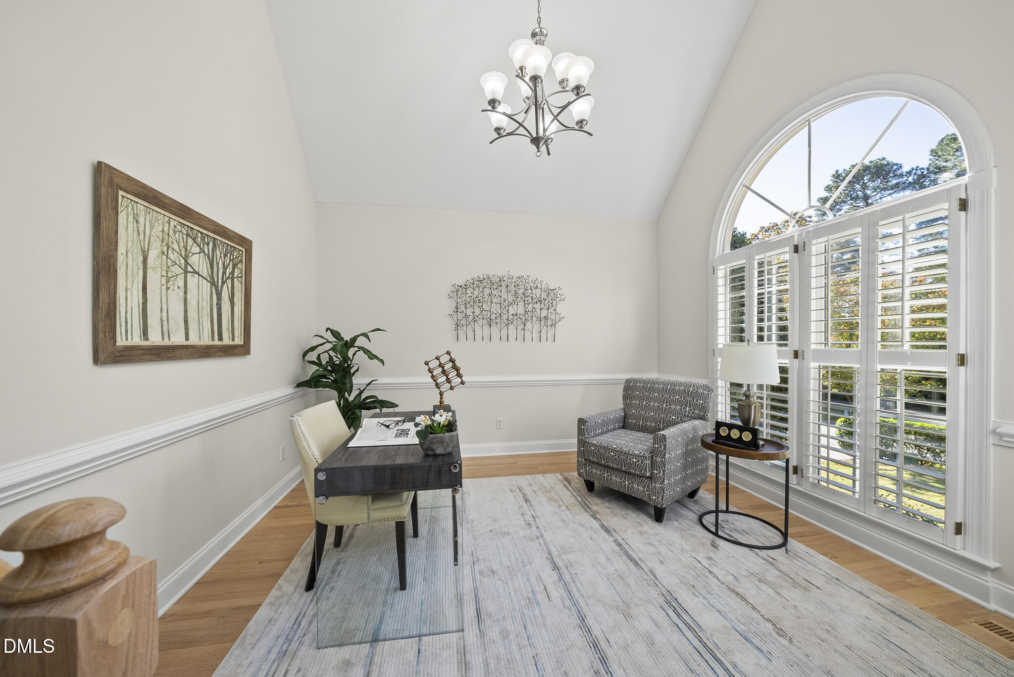 305 Ridge Creek Drive Morrisville, NC 27560 - Photo 7 of 43 a living room with furniture a chandelier and a large window