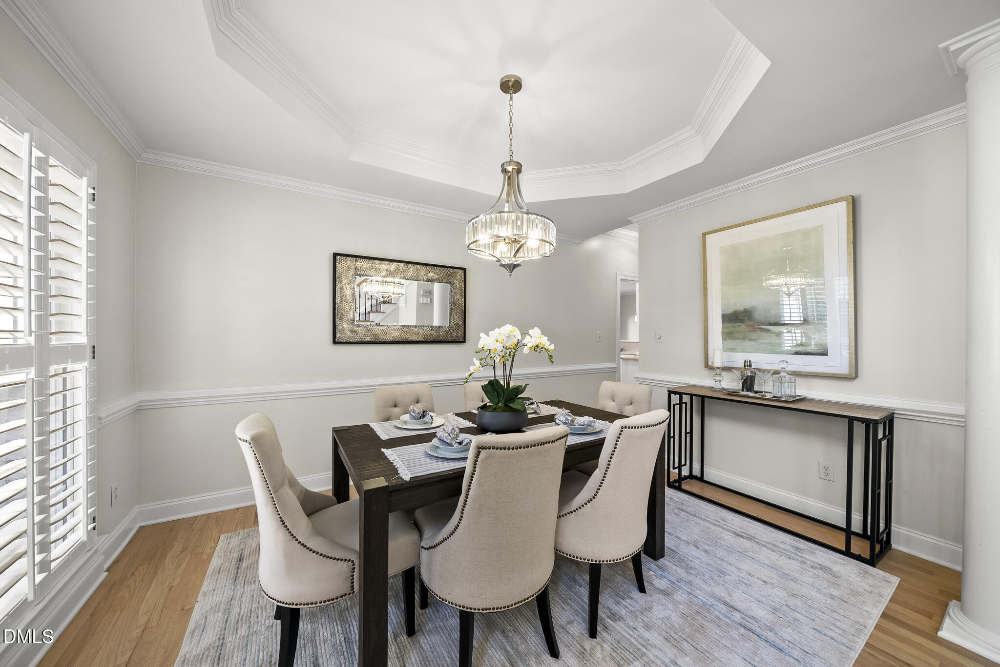305 Ridge Creek Drive Morrisville, NC 27560 - Photo 8 of 43 a dining room with furniture a chandelier and wooden floor