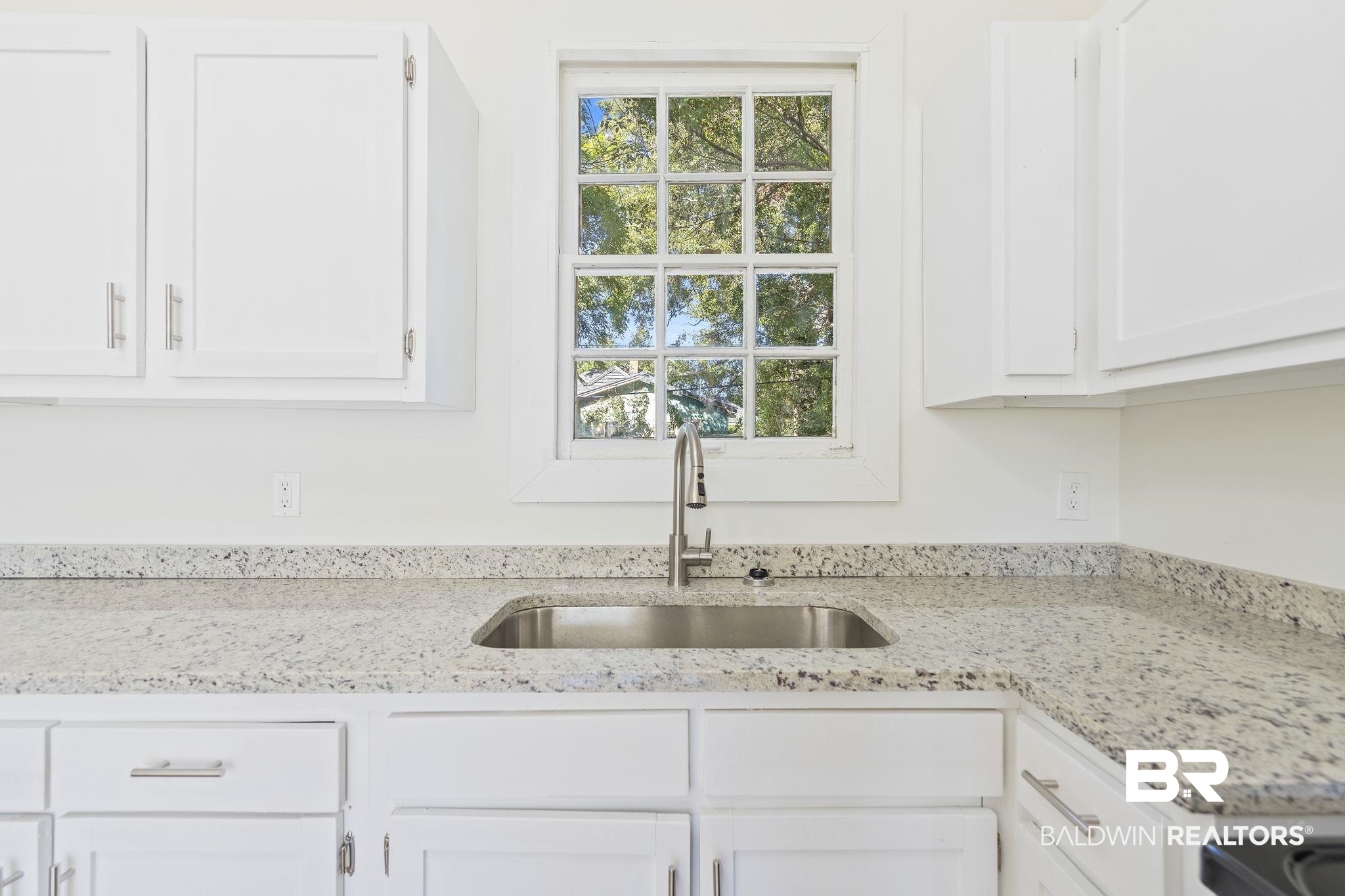 1400 North Cloverleaf Circle Mobile, AL 36605 - Photo 6 of 17 Kitchen featuring sink, white cabinetry, and light stone counters