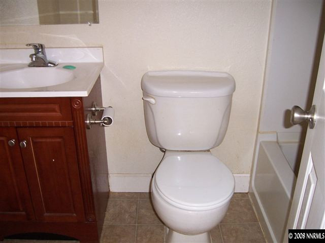 175 Grove, Unit 13 Reno, NV 89502 - Photo 6 of 6 a bathroom with a toilet and a sink