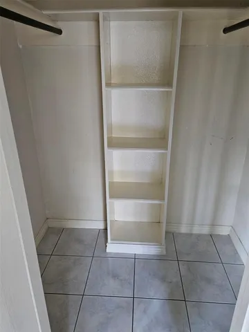 a bathroom with a sink a toilet a mirror and shower