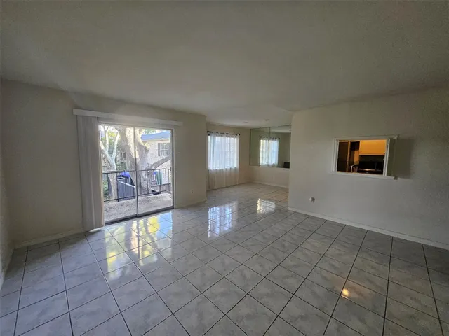 a view of an empty room and window