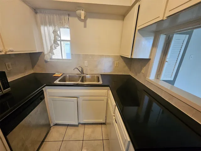 a kitchen with a refrigerator a sink a stove and a refrigerator