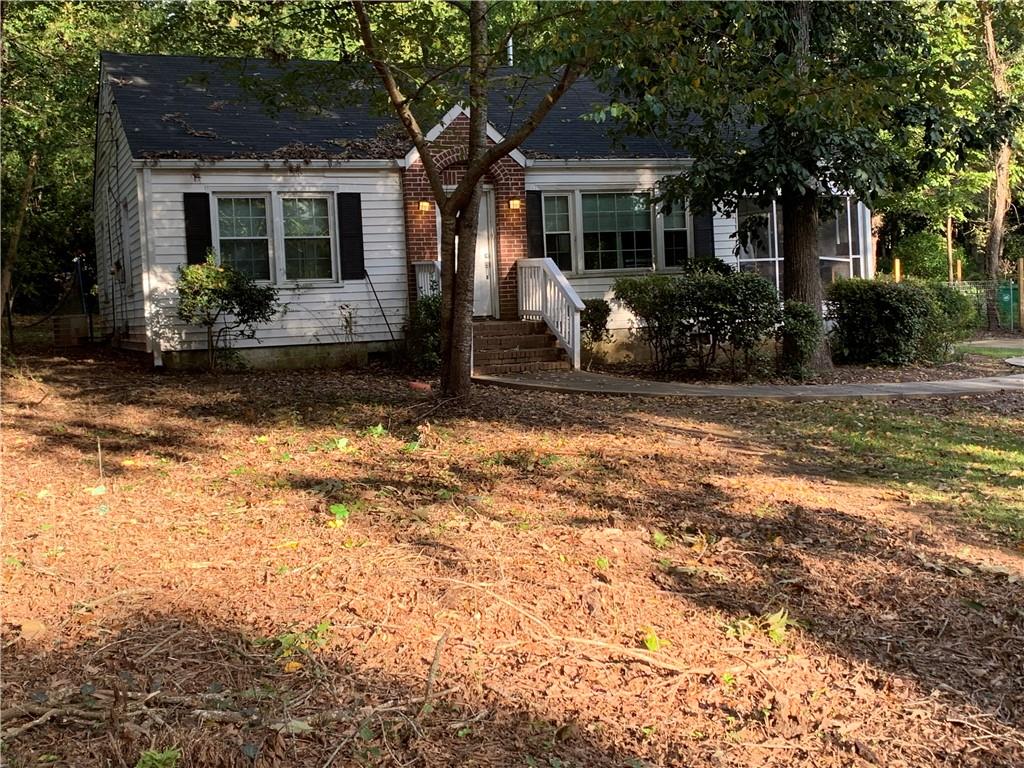 1350 Carter Road Decatur, GA 30030 - Photo 1 of 1 a front view of a house with garden