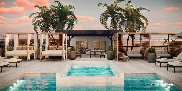 a view of a patio with table and chairs with wooden floor and fence