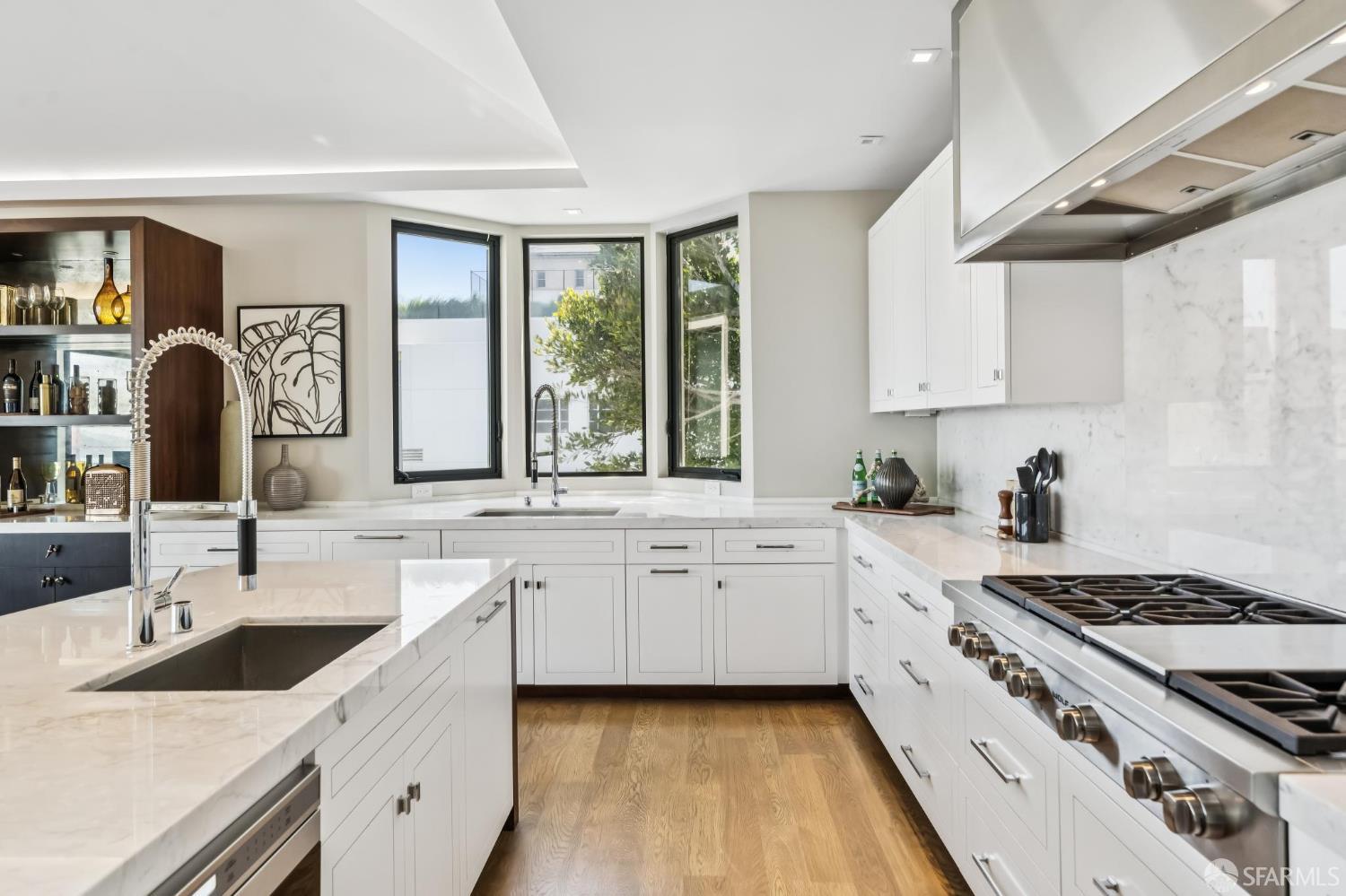 2755 Fillmore Street San Francisco, CA 94123 - Photo 22 of 99 a kitchen with granite countertop a sink stove and cabinets