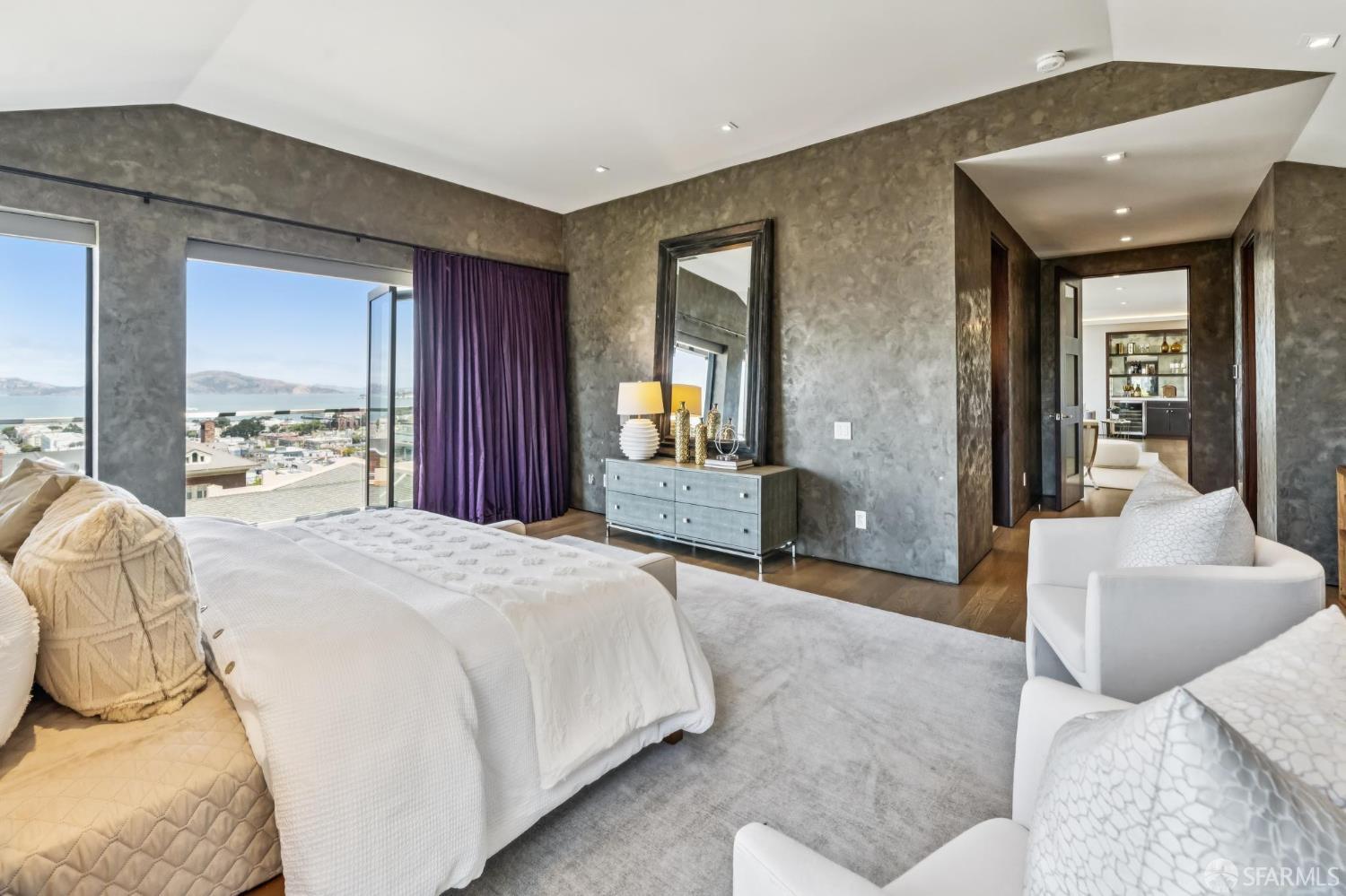 2755 Fillmore Street San Francisco, CA 94123 - Photo 48 of 99 a spacious bedroom with a bed and large window