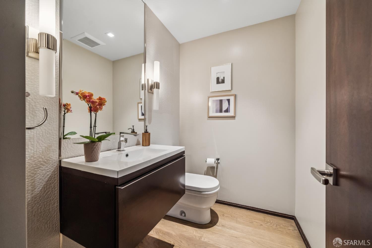 2755 Fillmore Street San Francisco, CA 94123 - Photo 86 of 99 a bathroom with a toilet sink and mirror