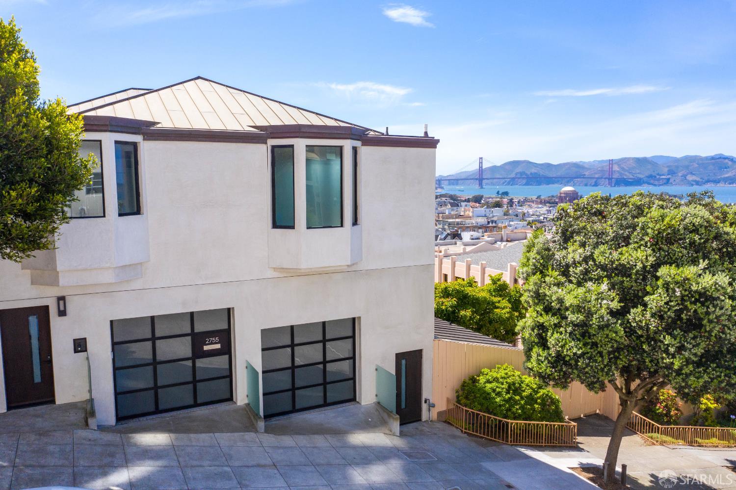2755 Fillmore Street San Francisco, CA 94123 - Photo 98 of 99 a front view of a house with a yard