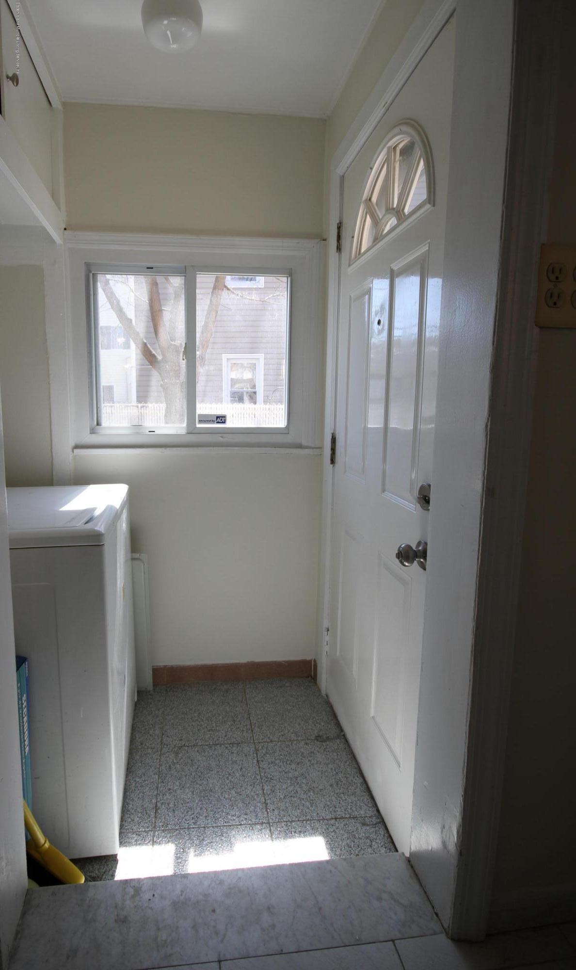 102-104 Robin Road Staten Island, NY 10305 - Photo 10 of 23 Washer/ Dryer area to yard. Left Unit