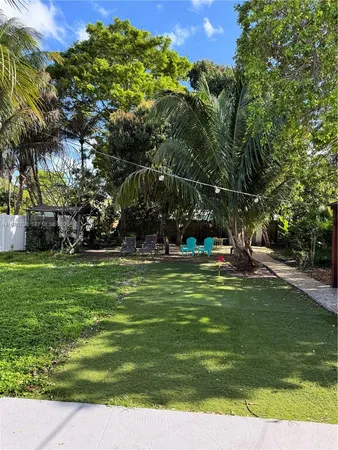 a view of a park with large trees