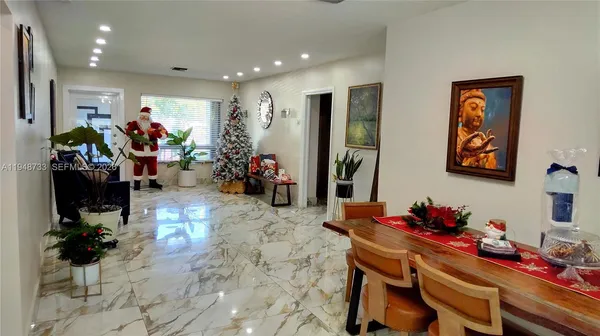 a living room with furniture and a mirror
