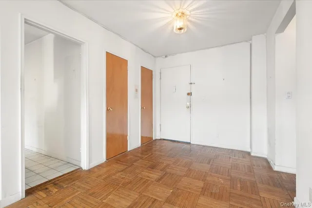 a view of a room with a ceiling fan