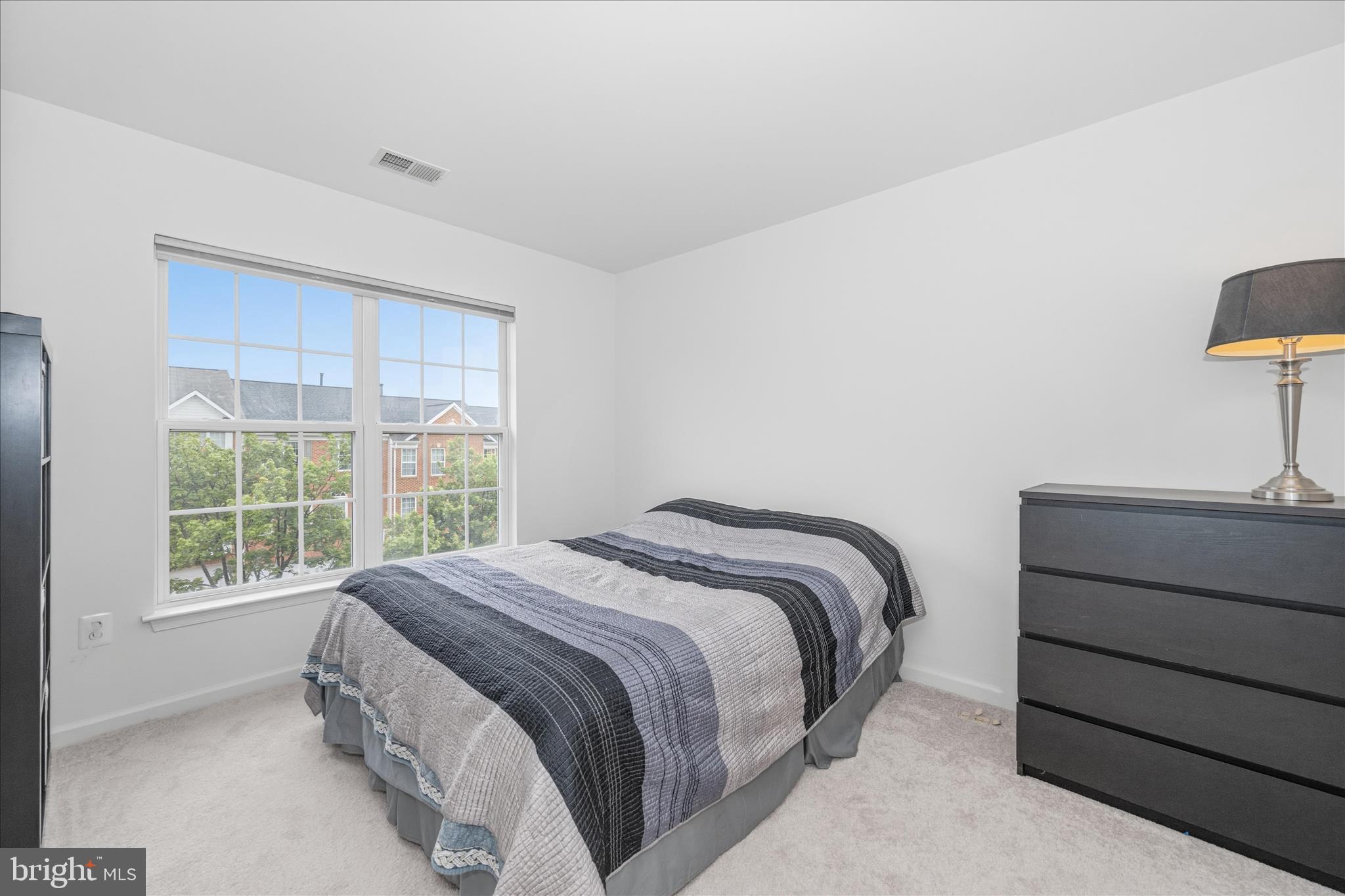 21 Inkberry Circle Gaithersburg, MD 20877 - Photo 37 of 51 a bedroom with a bed and a window