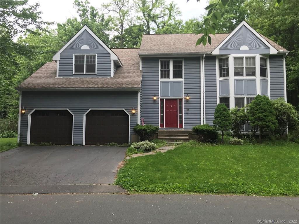 19 Village View Lane Farmington, CT 06085 - Photo 1 of 1 a front view of a house with a yard and garage