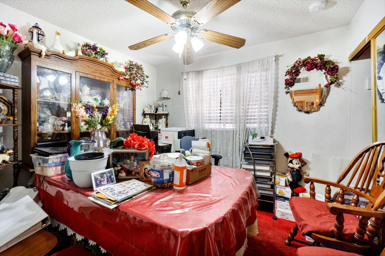 1735 South Maple Avenue Fresno, CA 93702 - Photo 11 of 24 a dining room with furniture and wooden floor