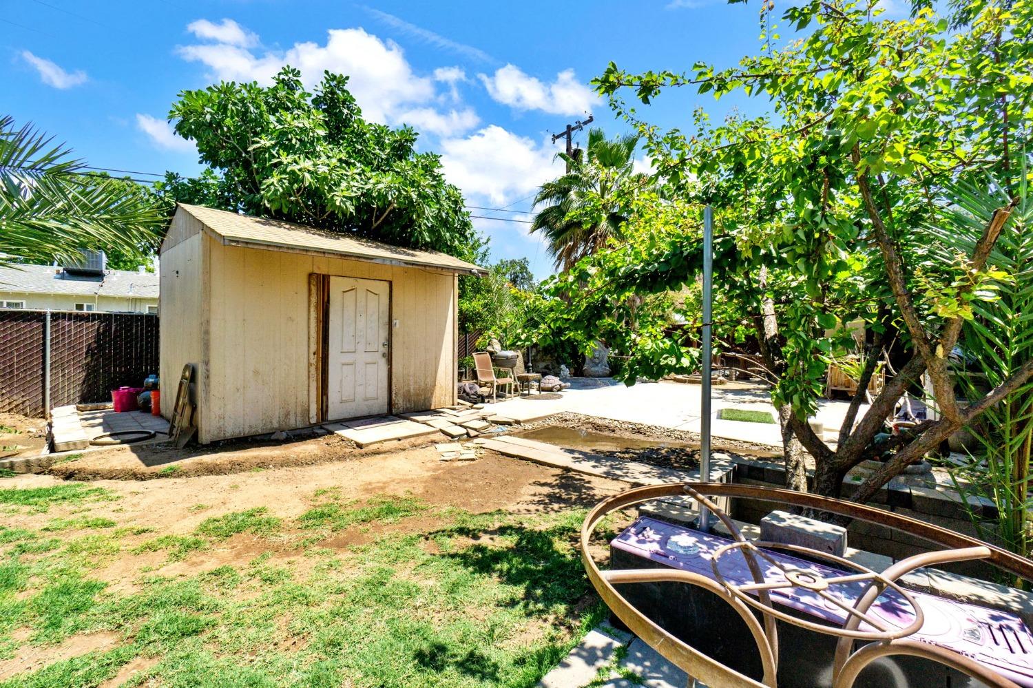 1735 South Maple Avenue Fresno, CA 93702 - Photo 17 of 24 a view of a backyard of the house