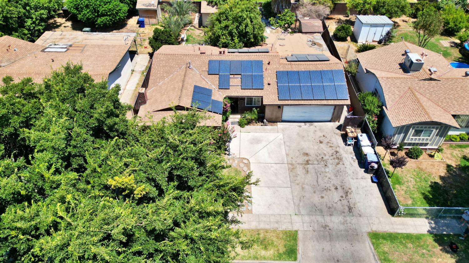 1735 South Maple Avenue Fresno, CA 93702 - Photo 20 of 24 an aerial view of a house with yard and seating space