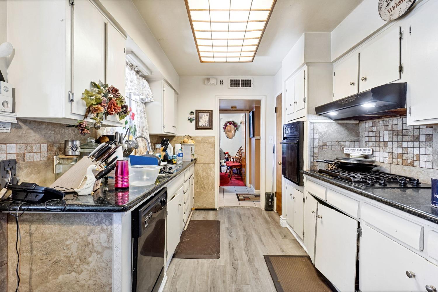 1735 South Maple Avenue Fresno, CA 93702 - Photo 9 of 24 a kitchen that has a lot of appliances