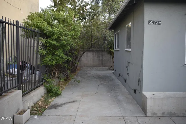 a backyard of a house with lots of green space