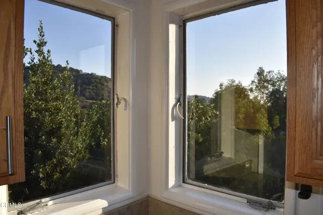 a view of a glass door and a window