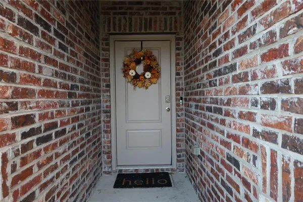 a view of a door and a window