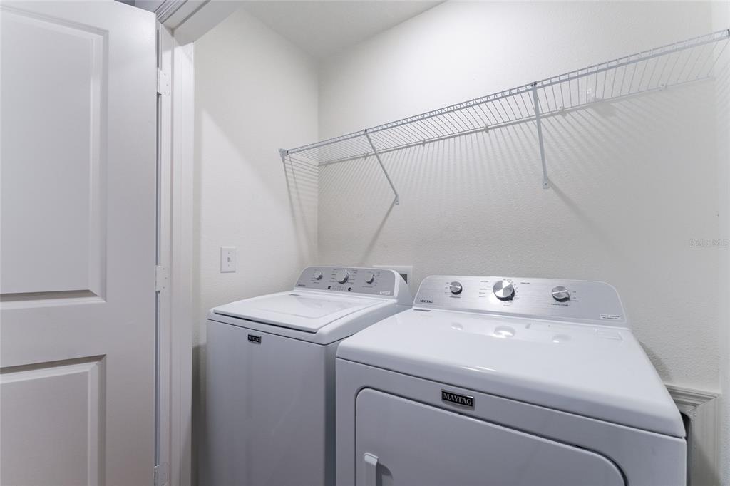 16607 Luminary Loop Clermont, FL 34714 - Photo 14 of 18 a utility room with dryer and washer