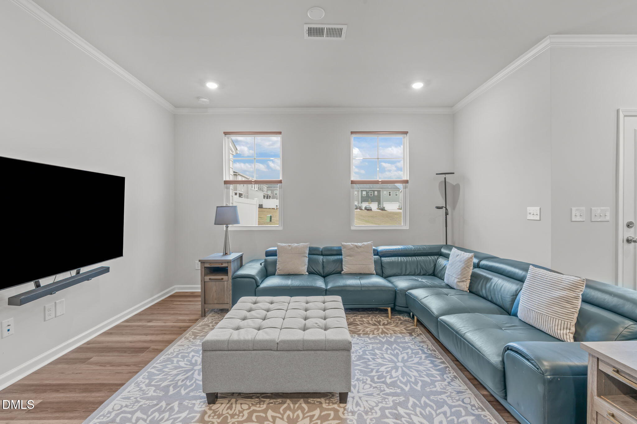 1809 Barrett Run Trail Apex, NC 27502 - Photo 15 of 37 a living room with furniture and a flat screen tv