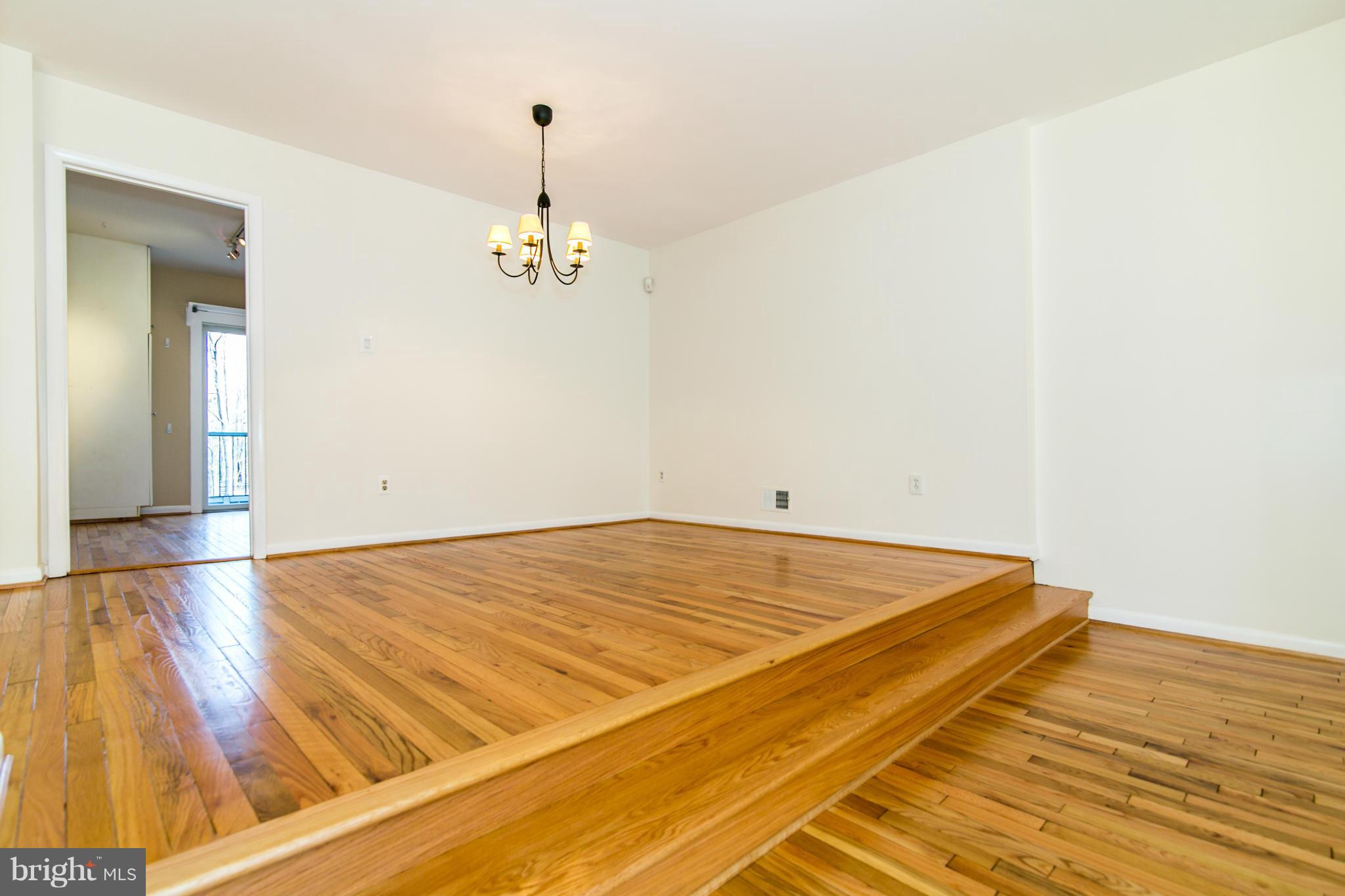 12017 Insha Court Reston, VA 20191 - Photo 5 of 30 The dining room has an updated chandelier.