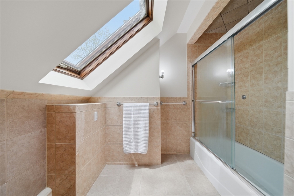 131 Range Heights Road Lynn, MA 01904 - Photo 23 of 36 a bathroom with a bathtub and a shower