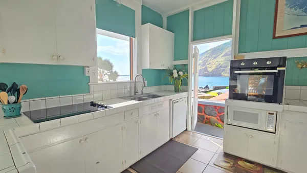 a kitchen with a stove a sink and a refrigerator