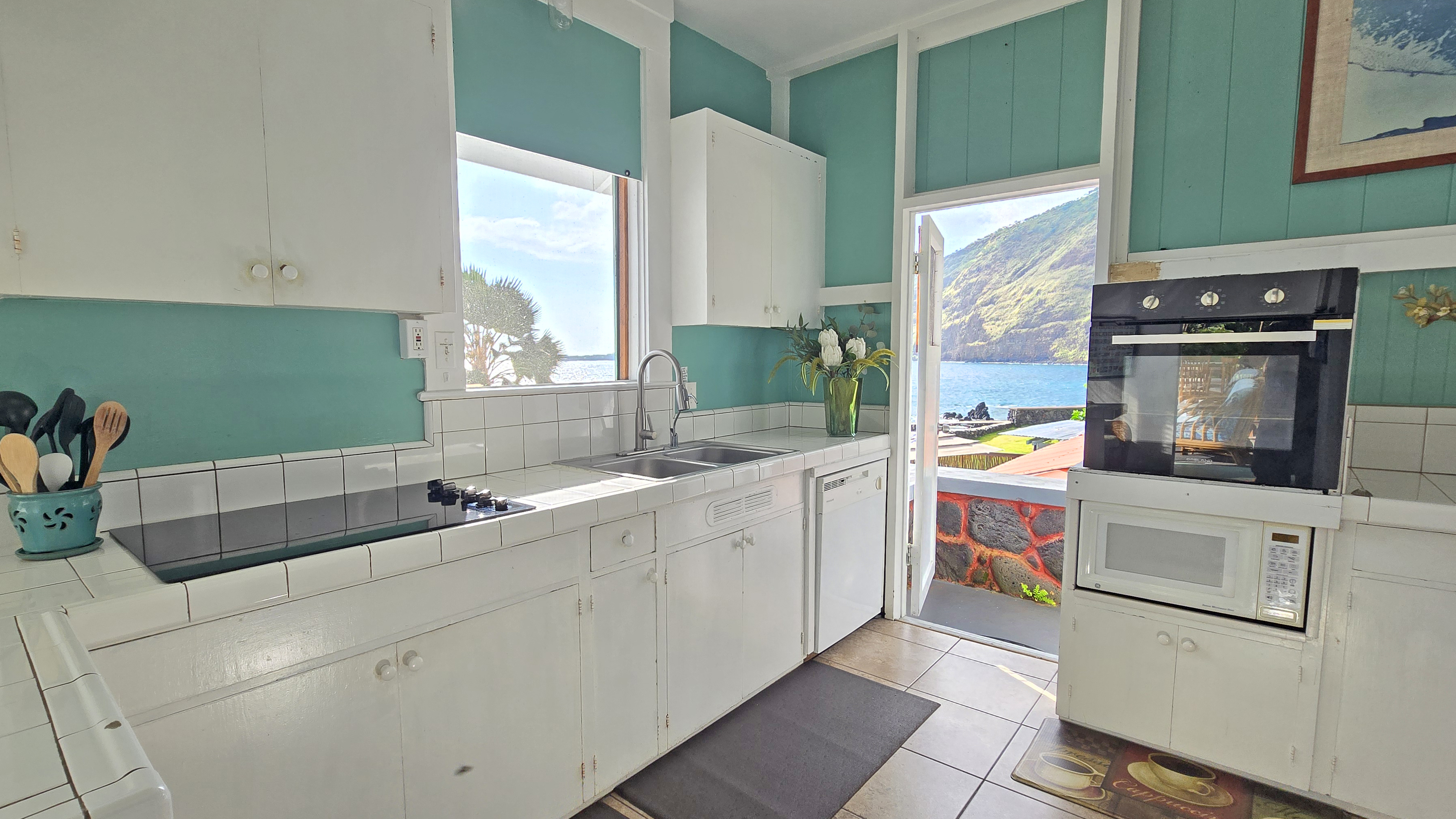 82-6047 Puuhonua Road Captain Cook, HI 96704 - Photo 12 of 25 a kitchen with a sink and a stove top oven