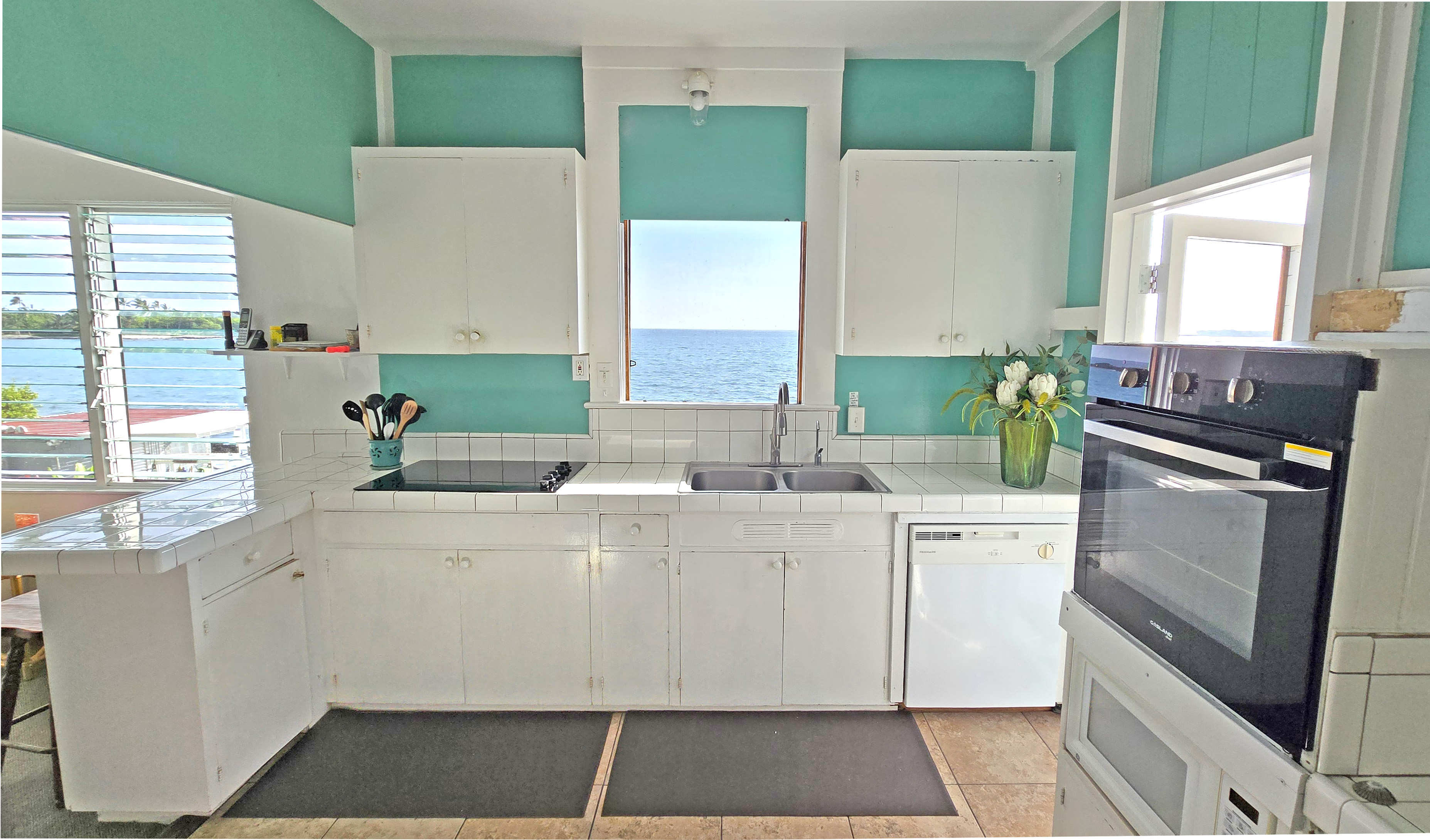 82-6047 Puuhonua Road Captain Cook, HI 96704 - Photo 13 of 25 a kitchen with a stove a sink and a refrigerator