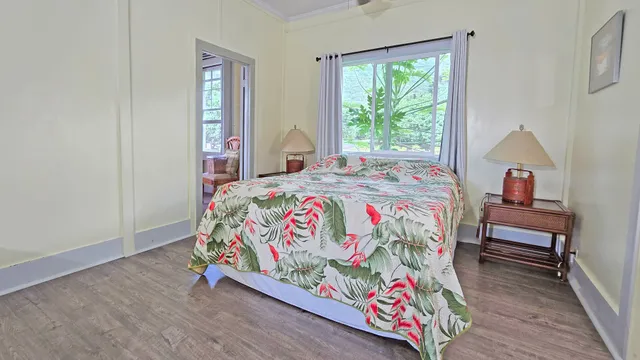 a bedroom with a bed and a dresser in it