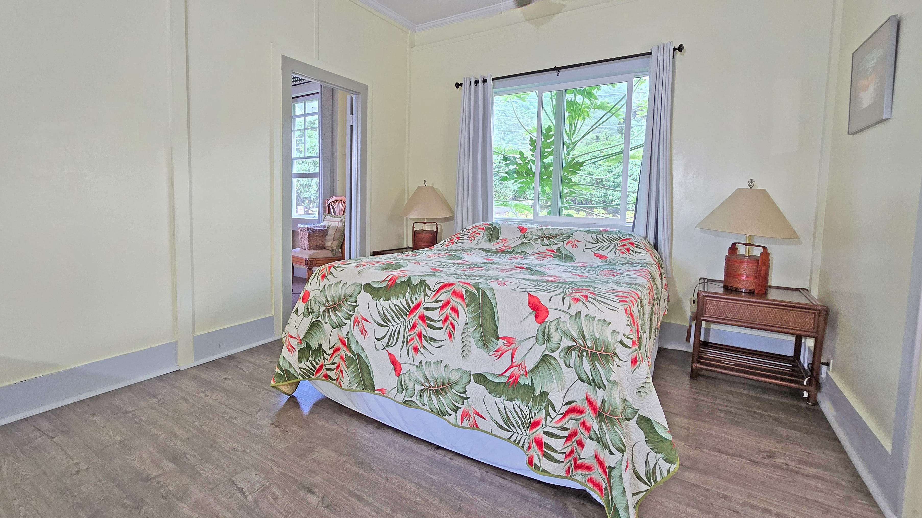 82-6047 Puuhonua Road Captain Cook, HI 96704 - Photo 16 of 25 a bed sitting in a bedroom next to a window
