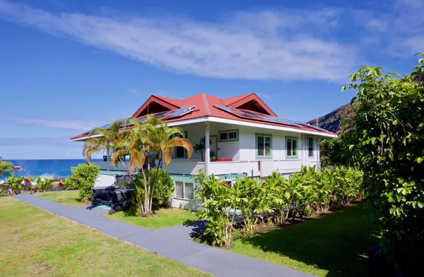 a front view of a house with a yard